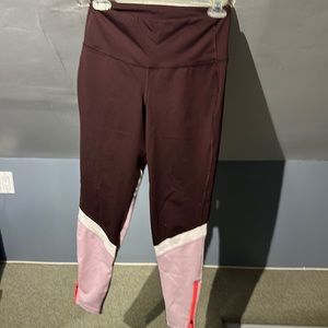 Purple, white, pink leggings. Zipper by ankles